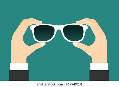 Two hands holds a sunglasses. Vector illustration flat design.