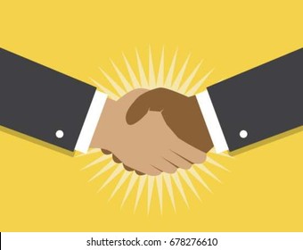 Two hands make a handshake on a yellow background and fancy the beginning of cooperation and partnerships