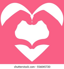 Two hands making heart shape on love symbol