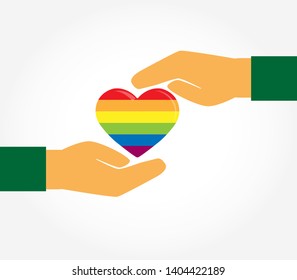 Two hands protect the silhouette of a heart in the colors of LGBT, flat design