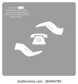 Two hands protecting or giving a phone