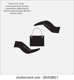Two hands protecting or giving a shopping bag