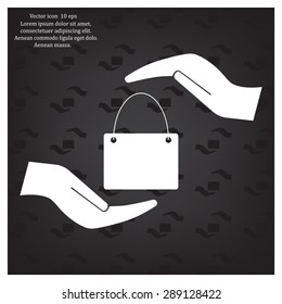 Two hands protecting or giving a shopping bag