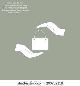 Two hands protecting or giving a shopping bag
