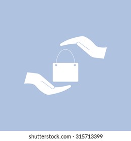 Two hands protecting or giving a shopping bag