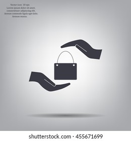 Two hands protecting or giving a shopping bag