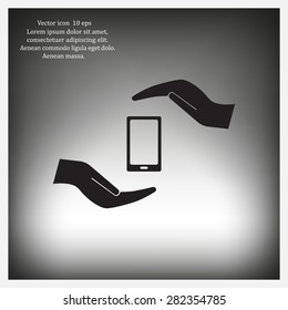 Two hands protecting or giving a smart phone