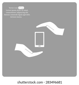 Two hands protecting or giving a smart phone