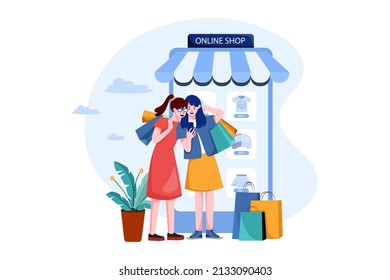 Two happy women go shopping online