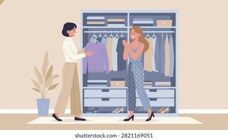 Two happy women trying on clothes and organizing their stylish wardrobe inside a large modern walk in closet.