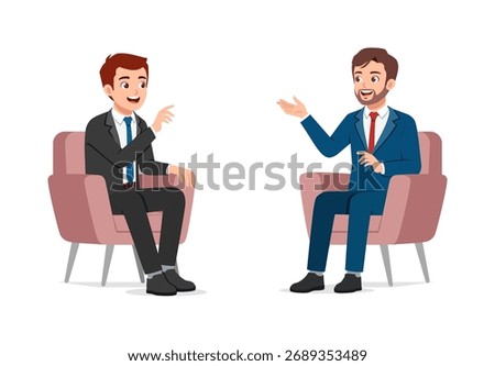 Two Happy Young Men Discussing Business Strategy While Sitting in Armchairs and Smiling