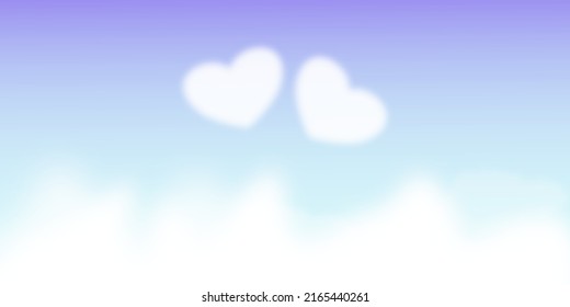 Two heart shaped clouds in the Pastel color sky.