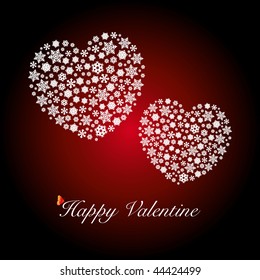 Two heart shapes made by snowflakes. Happy Valentine's Day.