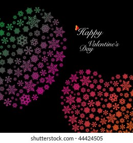 Two heart shapes made by snowflakes. Happy Valentine's Day.
