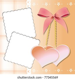 two hearts with a bow and two postcards on a pink background