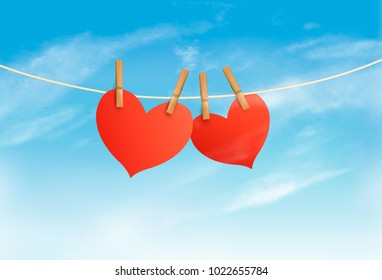 Two hearts hanging on a rope in front of a sky. Valentine's day vector. 