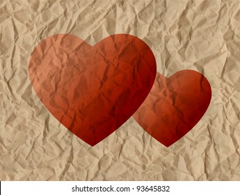 Two hearts on a crumpled paper
