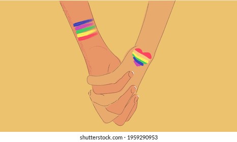Two holding hands with pride colors on skin to support lgbtq rights
