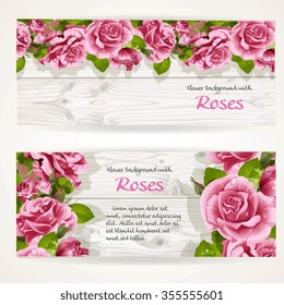 Two horizontal banners with pink roses on a white wood background