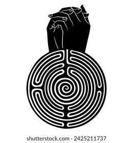 Two human hands folded in pray and a round spiral maze or labyrinth symbol. Creative concept. Black and whit silhouette.