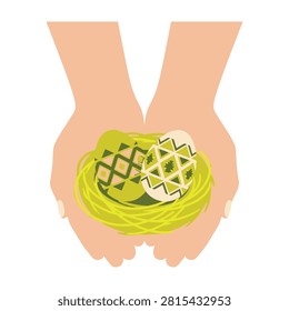 Two human hands gently cradling a small yellow nest containing two patterned Easter eggs. A festive spring concept representing care, tradition, and holiday joy.