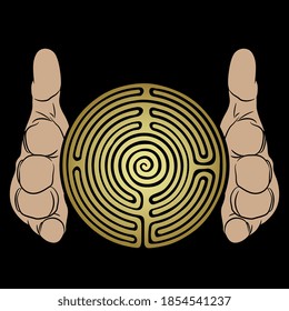 Two human hands holding round spiral golden maze or labyrinth symbol between them. Creative spiritual concept for knowledge.