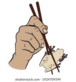 Two human hands holding tropical frog or toad with chopsticks. Funny concept for exotic food.