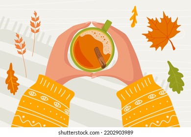 Dos manos humanas con mangas calientes de punto sosteniendo una taza de bebida caliente con canela sobre una mesa de madera cubierta con hojas de otoño. Humor otoñal. Ilustración vectorial de estilo plano en colores de hoja de otoño.