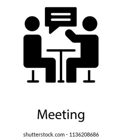 Two humans sitting on a table with chat bubble in between, showcasing meeting concept 