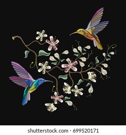 Two humming birds and blossoming cherry embroidery on black background. Cherry blosoom and tropical humming bird vector. Decorative floral sakura tree embroidery 
