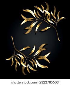 Two jewelry, gold, artistically painted willow twigs on a black background. Golden willow.