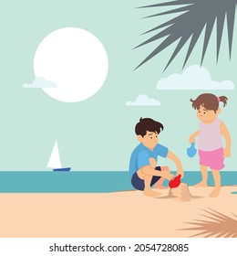 Two kids play sand on the beach