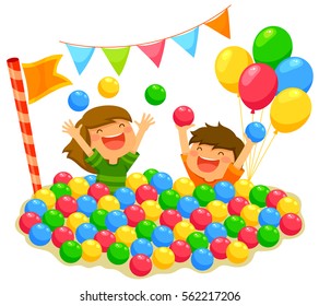 two kids playing in a ball pit with a festive atmosphere