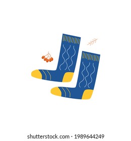 Two knitted blue socks with a pattern, isolated on a white background. Items from the autumn collection