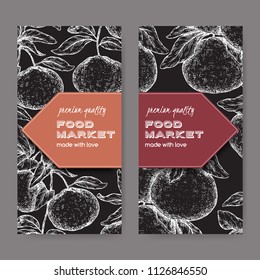 Two labels with mandarin and grapefruit sketch on black. Great for store and packaging design.