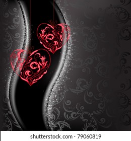 two lacy red hearts on a black background of sparkling