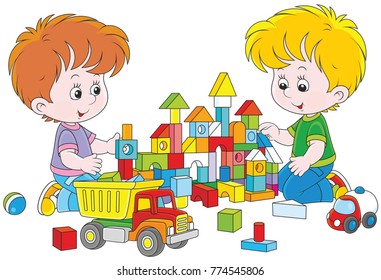 Two little boys playing with multicolor bricks and cars