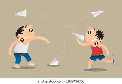 Two little boys playing paper plane flying