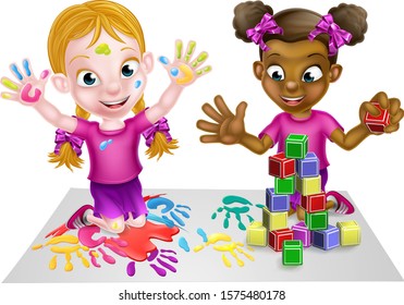 Two little girls, one black and one white, having fun playing with paints and building blocks.