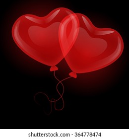 Two lovers soaring red gel balloons in the shape of hearts of interlaced ribbons on a black background.