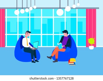 two male students reading book and using laptop men sitting armchairs preparing to exam concept modern co-working office interior full length flat horizontal