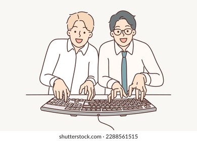 Two man computer geeks use keyboard to type code at same time to develop programs or applications. Young guys office workers and geeks play computer game together competing with each other 