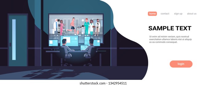 two men looking at monitors behind glass doctors group checking patient running on treadmill cardiology science dark office interior surveillance security system copy space