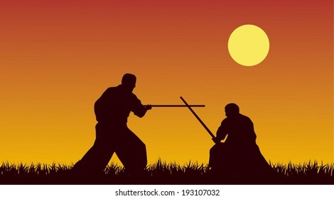 Two men are occupied with aikido against the yellow sky