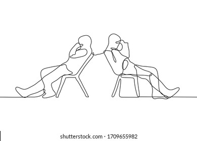 two men are sitting on chairs looking away from each other. The friends both had a hand in their face (fatigue, disappointment, facepalm). The concept of quarrel, intransigence, conflict, disagreement