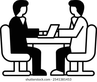 Two men sitting at a table with a laptop in front of them