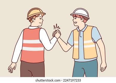 Two men in uniform of builders or repairmen shake hands holding each others palms tightly. Young guys in reflective vests and safety helmets demonstrate unity and solidarity. Flat vector design 