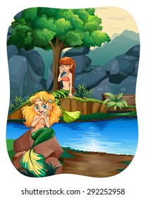 Two mermaids sitting on rock by the river