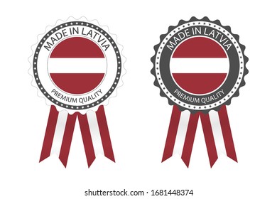 Two modern vector Made in Latvia labels isolated on white background, simple stickers in Latvian colors, premium quality stamp design, flag of Latvia