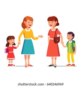 Two Mothers With School First Grader And Kindergarten Kid Boy And Girl Meet And Talking To Each Other, Gossiping. Mum Holding Kid By Hand.